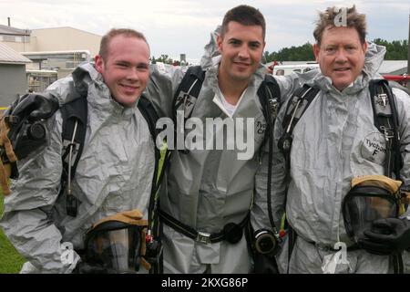 Chemical/Biological - Anniston, Ala. , August 4, 2011   (Left to Right) New York Fire Fighters Donald Cosman and William Farrell stand with Todd Jones, superintendent of the Center for Domestic Preparedness (CDP), following a training exercise at the Chemical, Ordnance, Biological, and Radiological (COBRA) Training Facility. COBRA courses prepare responders for a CBRNE incident by providing them the opportunity to practice their knowledge and skills in the nation's only toxic chemical training facility for civilian emergency responders. Learn more about the CDP at http://cdp. dhs. gov. (.. Pho Stock Photo