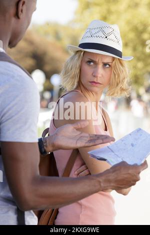 mixed-race couple are lost and arguing over route to take Stock Photo