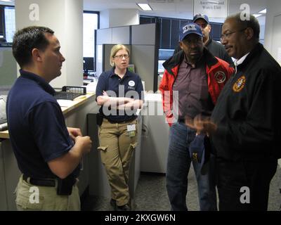 Flooding   Hurricane/Tropical Storm - Philadelphia, Pa. , August 27, 2011   Congressman Chaka Fattah & Philadelphia Mayor Michael Nutter receive a briefing from RRCC Manager John McGowan prior to the onset of hurricane Irene... Photographs Relating to Disasters and Emergency Management Programs, Activities, and Officials Stock Photo