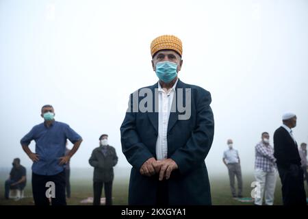 Bosnian Muslims offer Eid al-Adha prayers on the stadium during the outbreak of the coronavirus disease (COVID-19) in village of Zupca, Bosnia and Herzegovina, on July 31, 2020. Photo: Armin Durgut/PIXSELL  Stock Photo