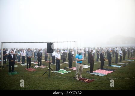 Bosnian Muslims offer Eid al-Adha prayers on the stadium during the outbreak of the coronavirus disease (COVID-19) in village of Zupca, Bosnia and Herzegovina, on July 31, 2020. Photo: Armin Durgut/PIXSELL  Stock Photo