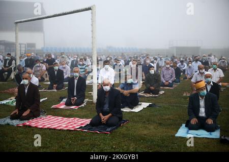 Bosnian Muslims offer Eid al-Adha prayers on the stadium during the outbreak of the coronavirus disease (COVID-19) in village of Zupca, Bosnia and Herzegovina, on July 31, 2020. Photo: Armin Durgut/PIXSELL  Stock Photo