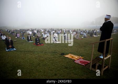 Bosnian Muslims offer Eid al-Adha prayers on the stadium during the outbreak of the coronavirus disease (COVID-19) in village of Zupca, Bosnia and Herzegovina, on July 31, 2020. Photo: Armin Durgut/PIXSELL  Stock Photo