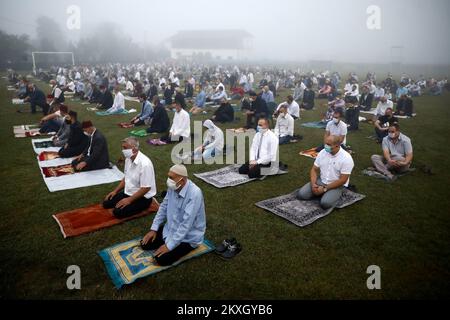 Bosnian Muslims offer Eid al-Adha prayers on the stadium during the outbreak of the coronavirus disease (COVID-19) in village of Zupca, Bosnia and Herzegovina, on July 31, 2020. Photo: Armin Durgut/PIXSELL  Stock Photo