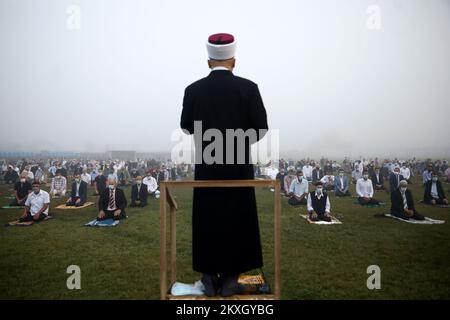 Bosnian Muslims offer Eid al-Adha prayers on the stadium during the outbreak of the coronavirus disease (COVID-19) in village of Zupca, Bosnia and Herzegovina, on July 31, 2020. Photo: Armin Durgut/PIXSELL  Stock Photo