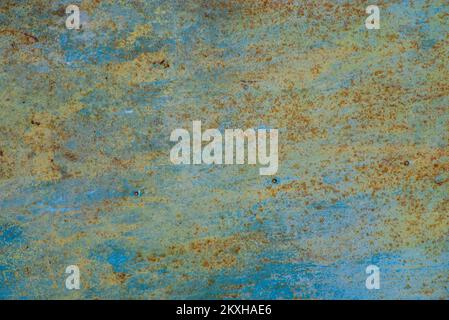 worn rusty metal texture background.Grunge rusty colored orange, green, blue, metal steel background texture, rust and oxidized metal background. Old Stock Photo