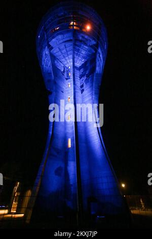 Vukovar Water Tower is illuminated with the colors, in Vukovar, Croatia, on October 19, 2020. Over recent days, the Vukovar water tower has lit up the night sky over eastern Slavonia in a range of colours. The Vukovar water tower is one of the most recognisable landmarks in the town.The multicoloured display heralds the opening up of the tower for visits. Famously damaged in fighting during the war, its scars are a constant reminder of the heavy bombardment the town received. The tower has been undergoing work in order that the structure can survive. The reconstruction and renovation has taken Stock Photo