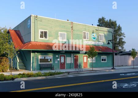 Carnation, WA, USA - October 02, 2022; Green wooden City of Carnation local government building with red awning Stock Photo