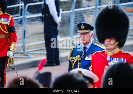 King Charles III walks behind the coffin of his mother, Majesty Queen Elizabeth II photographed during The ceremonial procession to transport her late Majesty Queen Elizabeth II’s coffin from Buckingham Palace to the Palace of Westminster at The Mall , London on Wednesday 14 September 2022 . Picture by Julie Edwards. Stock Photo