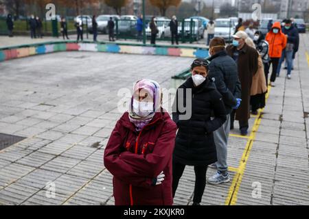 People wear protective masks as they wait to casts their ballots during municipal elections at a polling centre amid the spread of the coronavirus disease (COVID-19) in Sarajevo, Bosnia and Herzegovina on November 15, 2020. Municipal elections in Bosnia and Herzegovina include election of a mayor and municipal assembly across the 143 municipalities of Republika Srpska and the Federation of Bosnia and Herzegovina. Photo: Armin Durgut/PIXSELL Stock Photo
