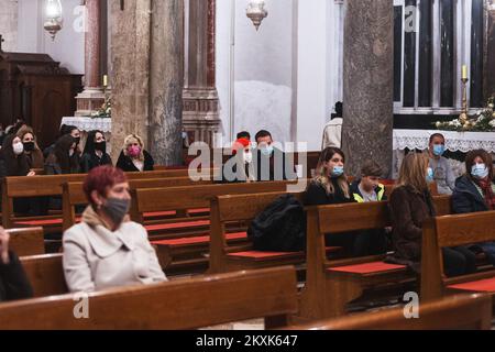 Believers seen attending midnight Mass at St. Anastasia Cathedral in Zadar, Croatia on December 24, 2020. Photo: Marko Dimic/PIXSELL Stock Photo