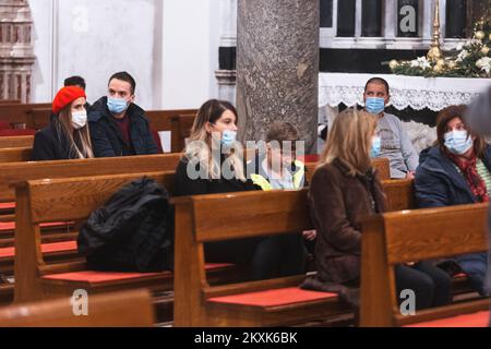 Believers seen attending midnight Mass at St. Anastasia Cathedral in Zadar, Croatia on December 24, 2020. Photo: Marko Dimic/PIXSELL Stock Photo