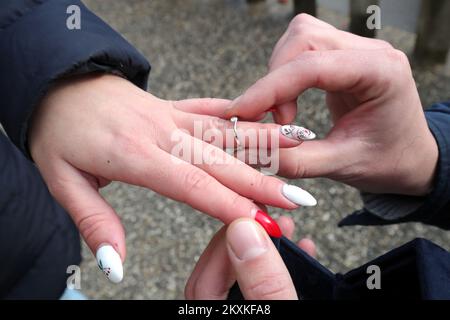 Dean Jadanic proposed to his girlfriend Ana Krznarevic in the ruins, at the place where he almost lost his life, in front of the Health Center in Petrinja, Croatia on January 9, 2021. They met four years ago at the store, where she worked, on her birthday. They started a relationship a few months later and have been inseparable ever since. Dean has been working as a medical technician at the Petrinja Health Center for thirteen years, and after the last earthquake on December 29, he barely pulled his head out. Now they both volunteer to help the victims of the earthquake, so they rarely see ea Stock Photo