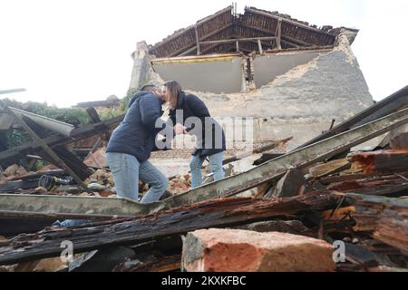 Dean Jadanic proposed to his girlfriend Ana Krznarevic in the ruins, at the place where he almost lost his life, in front of the Health Center in Petrinja, Croatia on January 9, 2021. They met four years ago at the store, where she worked, on her birthday. They started a relationship a few months later and have been inseparable ever since. Dean has been working as a medical technician at the Petrinja Health Center for thirteen years, and after the last earthquake on December 29, he barely pulled his head out. Now they both volunteer to help the victims of the earthquake, so they rarely see ea Stock Photo