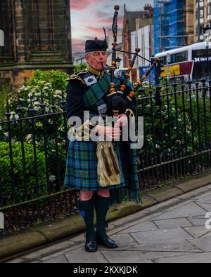 Man playing bagpipes in Edinburgh, Scotland Stock Photo