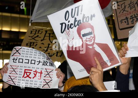 Tokyo, Japan. 30th Nov, 2022. Tokyoites, Hong Kongers, Taiwanese, Uyghurs and Chinese dissidents protest outside Shinjuku Station against President Xi Jingping and the governing Chinese Communist Party's (CCP) draconian Zero-COVID policy after a fire in an ÃœrÃ¼mqi, capitol of the Xinjiang Uyghur Autonomous Region, high rise building killed 10 people. (Credit Image: © Taidgh Barron/ZUMA Press Wire) Credit: ZUMA Press, Inc./Alamy Live News Stock Photo