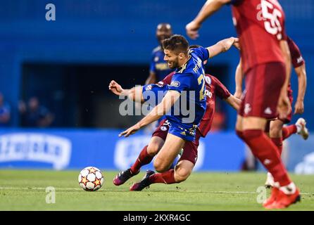 Croatia, Zagreb - AUGUST 4, 2021 Bartosz Slisz, Bruno Petkovic during UEFA Champions League third qualifying round Leg 1 football match between Dinamo Zagreb and Legia Warsaw on Maksimir Stadium. Photo: Josip Regovic/PIXSELL Stock Photo