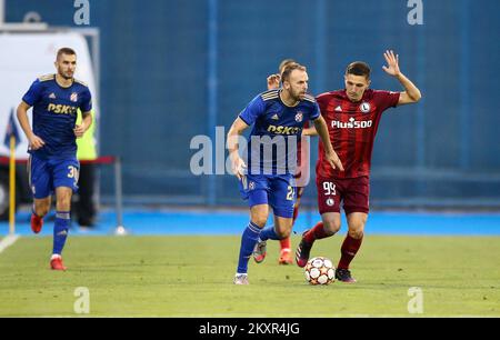 Croatia, Zagreb - AUGUST 4, 2021 Josip Misic, Bartosz Slisz during UEFA Champions League third qualifying round Leg 1 football match between Dinamo Zagreb and Legia Warsaw on Maksimir Stadium. Photo: Matija Habljak/PIXSELL Stock Photo