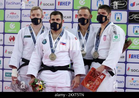 ZAGREB, CROATIA - SEPTEMBER 26: (L-R) Silver medalist Dario Kurbjeweit Garcia of Germany, gold medalist Arman Adamian of Russia and bronze medalists Simeon Catharina of Netherlands and Marko Kumric of Croatia during the Men's -100kg medal ceremony on day 3 of the Judo Grand Prix Zagreb 2021 at Arena Zagreb in Zagreb, Croatia on September 26, 2021. Photo: Igor Kralj/PIXSELL Stock Photo