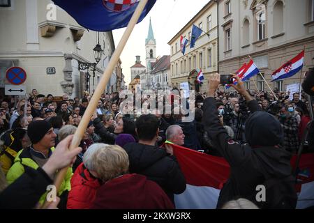 Protesters during the demonstrations in Zagreb, Croatia on Nov. 13, 2021. A lot of people gathered to protest against COVID certificates which means that citizens must be vaccinated or have a negative test to enter certain public areas. The protest was organized by Vigilare, coservative catholic association, in front of St. Mark's Square. Photo: Emica Elvedij/PIXSELL Stock Photo