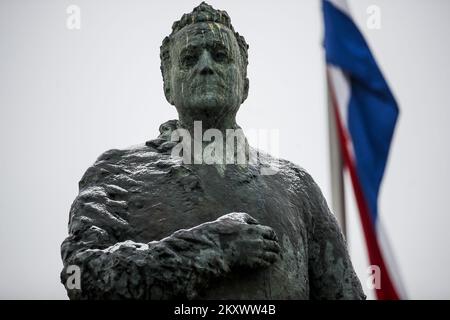 The statue of the first Croatian president Franjo Tudjman is lightly covered with snow, in Zagreb, Croatia, on December 27, 2021. Photo: Slavko Midzor/PIXSELL Stock Photo