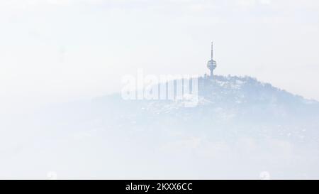 Hum antenna tower breaks through fog and smog in Sarajevo, Bosnia and ...