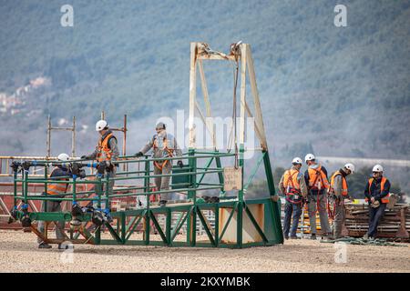 Preparations for the installation of the last segment of the steel span structure of the Ston bridge as part of The South Dalmatia Road Connectivity project, on March 15, 2022, in Broce, near Ston, Croatia. The project consists of the construction of a 32.5 km alternative road entirely within Croatia to bypass the two border crossings with Bosnia and Herzegovina (BiH) to cross the BiH Neum coastal land strip. The project includes the 2.4 km long Peljesac bridge and also 12 km of access roads, the improvement of 10.2 km of the existing D414 road and the construction of a 7.9 km bypass around th Stock Photo