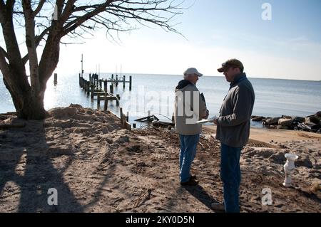 Whitehaven, Md., Nov. 14, 2012   Duane Woodruff (left), Small Business Administration, and James Taylor (right), FEMA, assess damage from Hurricane Sandy to a pier in Whitehaven, MD, in Wicomico County. FEMA and county officials were assessing the effects from Hurricane Sandy. Maryland Hurricane Sandy. Photographs Relating to Disasters and Emergency Management Programs, Activities, and Officials Stock Photo