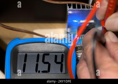 Digital multimeter voltage ampere meter tester measuring device for checking measure electronics circuit instrument with cable prod measurement Stock Photo
