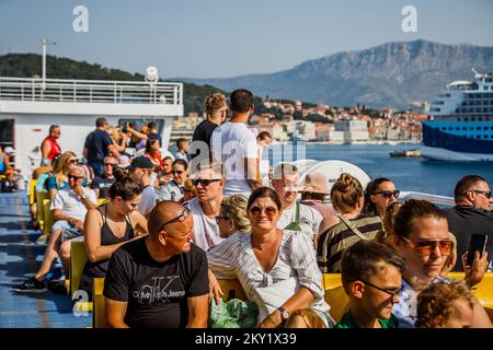 Tourists are seen on a ferry from Split to Supetar on the island of Brac, on June 22, 2022, in Split, Croatia. Photo: Zvonimir Barisin/PIXSELL Stock Photo