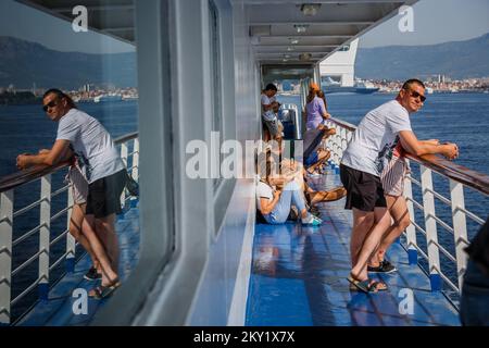 Tourists are seen on a ferry from Split to Supetar on the island of Brac, on June 22, 2022, in Split, Croatia. Photo: Zvonimir Barisin/PIXSELL Stock Photo