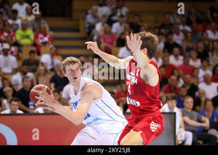 RIJEKA, CROATIA - JULY 03: Lauri Markkanen of Finland a shoots the ball against Roko Prkacin during the FIBA Basketball World Cup 2023 Qualifying game between Croatia and Finland at Sports hall Zamet on July 3, 2022 in Rijeka, Croatia. Photo: Goran Kovacic/PIXSELL Stock Photo