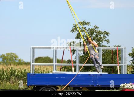 The workers decided to use part of the break to swing on the ropes in Zagreb, Croatia on August 1, 2022. Photo: Zeljko Hladika/PIXSELL Stock Photo