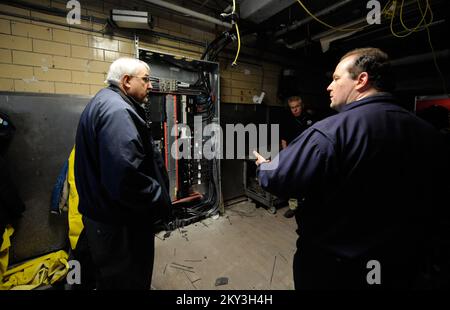 New York, N.Y., Dec. 14, 2012   FEMA Administrator Craig Fugate, left, along with FEMA Federal Coordinating Officer Michael Byrne, center, get a tour of damage caused by Hurricane Sandy at the Coney Island Hospital by Director of Facilities, Daniel Collins. They were joined by hospital administration and were shown areas of the hospital impacted by Hurricane Sandy. New York, NY, Dec. 14, 2012--FEMA Administrator Craig Fugate,, left,  along with FEMA Federal Coordinating Officer Michael Byrne, center, get a tour of damage caused by Hurricane Sandy at the Coney Island Hospital by Director of Fac Stock Photo