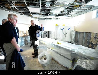 New York, N.Y., Dec. 14, 2012  Administrator Craig Fugate, right, along with FEMA Federal Coordinating Officer Michael Byrne, left, get a tour of damage caused by Hurricane Sandy at the Coney Island Hospital. They were joined by hospital administration and were shown areas of the hospital impacted by Hurricane Sandy. This particular room has imaging equipment that was destroyed by the storm surge waters.. New York, NY, Dec. 14, 2012--Administrator Craig Fugate, right, along with FEMA Federal Coordinating Officer Michael Byrne, left, get a tour of damage caused by Hurricane Sandy at the Coney I Stock Photo