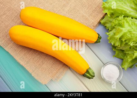yellow courgette on wood background top view Stock Photo