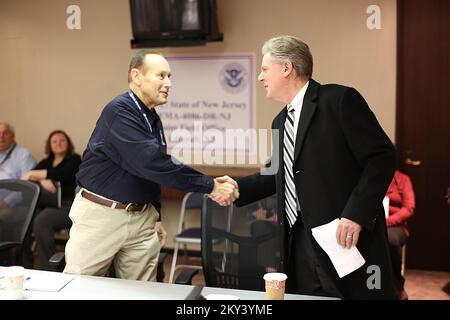 Lincroft, N.J., Jan. 7, 2013   FEMA Federal Coordinating Officer (FCO) Michael J. Hall welcomes Congressman Frank Pallone (D) to a briefing at the Joint Field Office regarding the recovery efforts associated with hurricane Sandy. The Congressional Affairs Division is the Federal Emergency Management Agency's primary liaison with the United States Congress. Our mission is to proactively engage and communicate with Members of Congress and their staffs to build strong working relationships that will advance the agency's legislative and emergency management priorities. Adam DuBrowa/ FEMA. New Jers Stock Photo