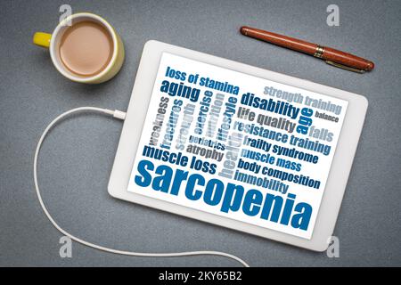 sarcopenia - muscle loss due to aging, word cloud on a digital tablet, health and senior fitness concept Stock Photo