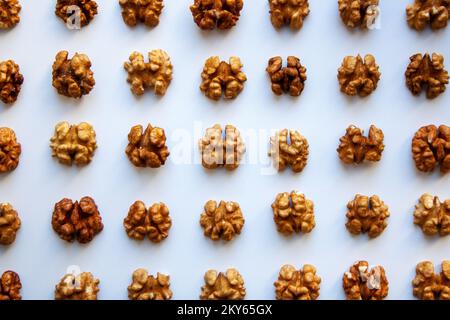 Raw walnuts meats pattern isolated on white background from a high angle view Stock Photo