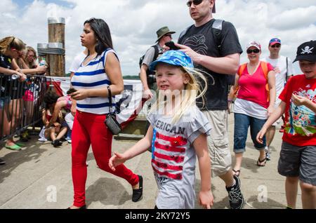 Liberty Island, N.Y., July 4, 2013  Visitors from around the world returned to Liberty Island for the official reopening of the Statue of Liberty. Hurricane Sandy flooded 75%%%%%%%%%%%%%%%% of the island in October 2012 causing major damage to its infrastructure and facilities. The Statue was reopened on July 4th following eight months of extensive repairs. K.C.Wilsey/FEMA. New York Hurricane Sandy. Photographs Relating to Disasters and Emergency Management Programs, Activities, and Officials Stock Photo