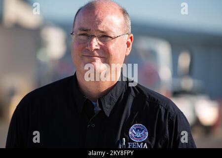 Little Rock, AR, May 4, 2014 ; Federal Coordinating Officer (FCO) Timothy Scranton awaits the arrival of Department of Homeland Security (DHS) Secretary Jeh Johnson at Clinton National Airport in Little Rock to begin a survey of tornado damage in Mayflower and Vilonia, Arkansas, which were struck by an EF-4 tornado on April 27. As an agency of the Department of Homeland Security, FEMA assists individuals and supports local, state and tribal governments in their efforts to recover from natural disasters. Arkansas Severe Storms, Tornadoes, and Flooding. Photographs Relating to Disasters and Emer Stock Photo