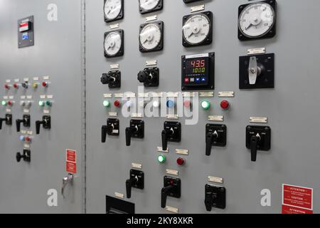 An electrical generation panel with buttons, gauges and switches Stock Photo