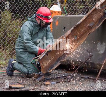 MA-TF1 Urban Search and Rescue members cut and break through slabs of ...
