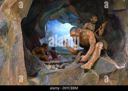 A display of ancient civilization, including a diorama of stone age man in a cave. At the Local History Museum in Karaganda, Kazakhstan. Stock Photo