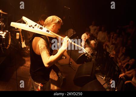 Time to rock out with a solo...A rock guitarist on stage at a concert. Stock Photo