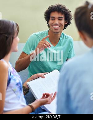 I think we should go over this once more...Cropped view of college students studying together for their finals. Stock Photo