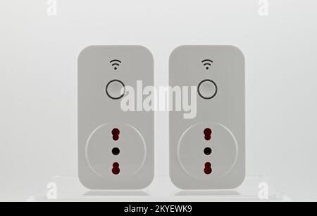Smart wi-fi plug with energy monitor isolated on white background. Stock Photo