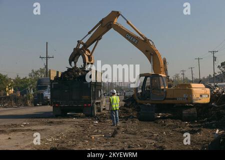 Hurricane Katrina, Plaquemines Parish, LA., 10/18/2005 -- A dump truck is filled with debris in Plaquemines Parish from Hurricane Katrina. FEMA photo/Andrea Booher Stock Photo