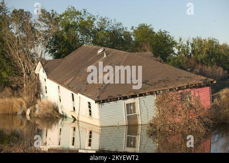 Hurricane Katrina, Plaquemines Parish, LA, 10/18/2005 -- A house floats in an irrigation ditch - far from it's foundation due to Hurricane Katrina. FEMA photo/Andrea Booher Stock Photo