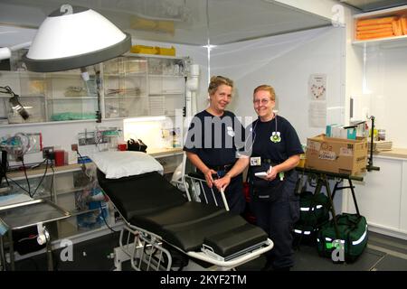 Hurricane Katrina, Plaquemines Parish, LA November 7, 2005 - RN Daryl Wentworth, Deputy Commander of the National Disaster Medical System Mobile Medical Unit, and Commander Ann Bollmann, RPAC, described the features offered in innovative new portable hospital. The MMU has a pharmacy, an operating room, and an x-ray machine. Stock Photo